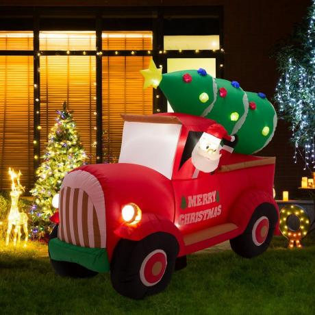 Kerstman op pick-up truck opblaasbaar decor