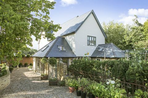 Huis aan de rivier met uitzicht op de Theems